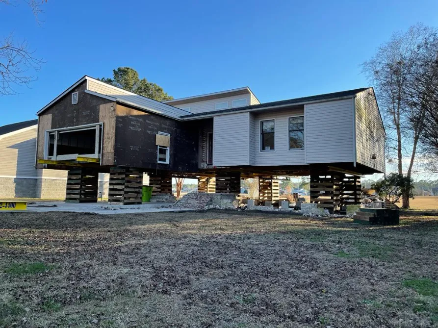 A home mid way while a new foundation is being built. (angle 2)