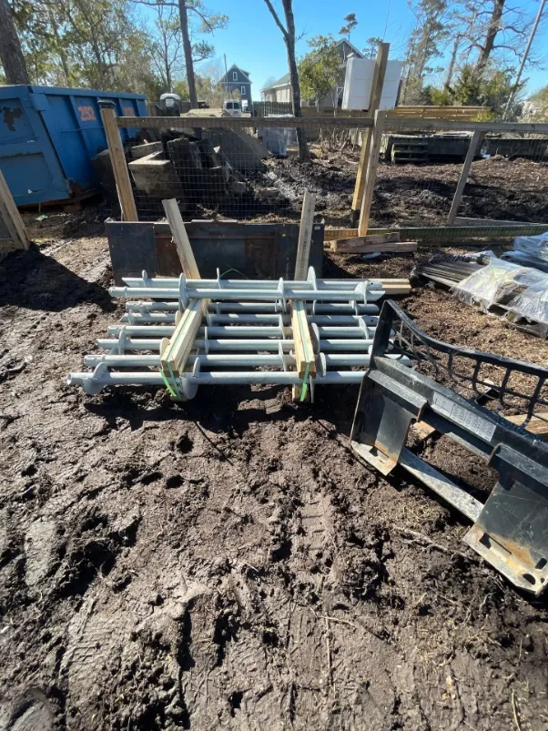 Helical piling being installed under a residential property in North Carolina (project 8)