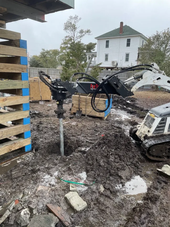 Helical piling being installed under a residential property in North Carolina (project 9)